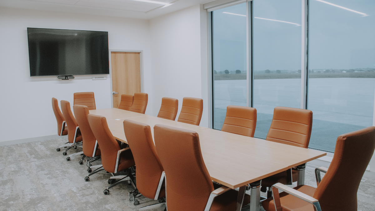 Conference room at Watertown Regional Airport with runway view